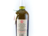 a bottle of olive oil on a white surface