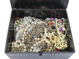 a black box filled with lots of different types of jewelry