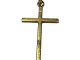 un gros plan d'une croix sur fond blanc