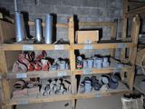 many pots and pans on the shelves in the room