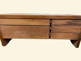 a small wooden chest with two drawers on it