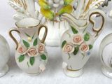 five vases that are sitting on a table