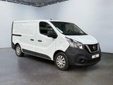 the white van is parked in the large room of the building