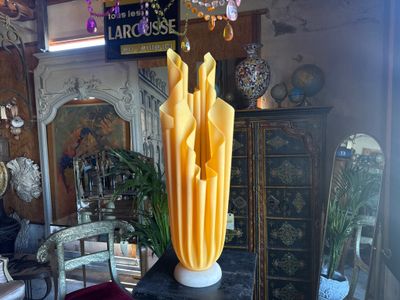a vase that is sitting on a table in a room