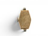 a close up of a gold ring on a white surface