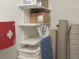 a closet with a lot of supplies on the shelves