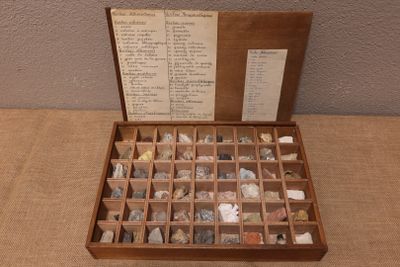 a wooden box filled with different types of rocks
