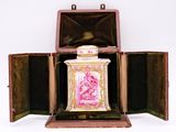 a pink and gold box with a pink and white picture on it