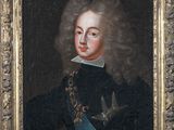 portrait of a gentleman in a black coat with a bird in his hand