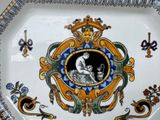 a decorative plate with a picture of a woman on it