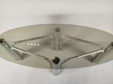 a glass table with metal legs and a glass top