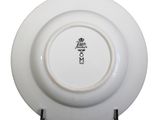 a white plate with a black and white design on it