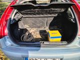 the back of a car with its trunk open and a box in the trunk