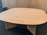 a close up of a wooden table in an office setting