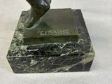 statue of a woman ' s foot on a marble base