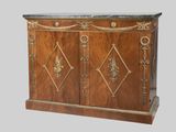 a wooden cabinet with a marble top and gold decorations on it