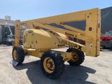 a yellow crane that is parked in a parking lot