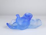an image of a blue glass bowl sitting on top of a white surface