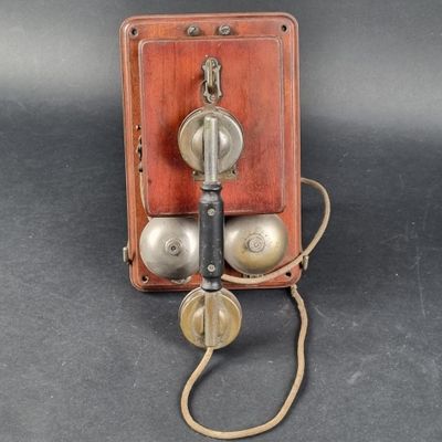 an old fashioned telephone that is sitting on a table
