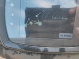 a close up of a clock on the side of a motorcycle