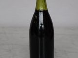 a bottle of wine that is sitting on a table