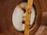 a close up of a metal object with a hole in it