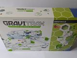 a box with a toy train set inside of it