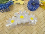 a bunch of plastic flowers on a table