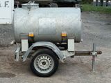 a trailer with a tank attached to the back of it