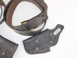 three pieces of leather on a white surface
