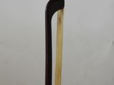 a close up of a cane with a wooden handle on a table