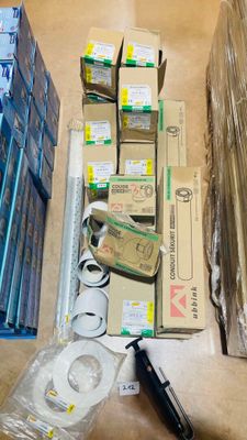 a lot of boxes and a pair of scissors on the floor
