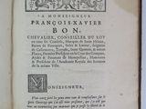 an open book with a black and white image of a bird on it