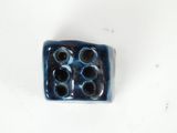 a small blue object that is on a white surface