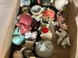 a cardboard box filled with many different types of figurines