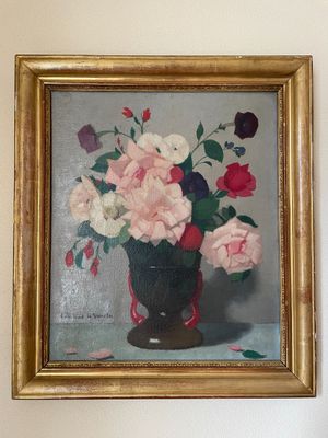 un tableau de fleurs dans un vase sur le mur