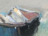 un tableau représentant un bateau posé sur une table