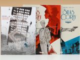 trois livres sont empilés sur une table