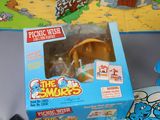 a box of the smurfs toys on the table
