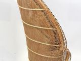 an image of a wicker chair sitting on top of a white floor