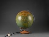an old globe with a wooden base and a wire plugged into it