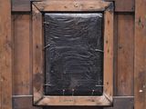 a picture of a wooden frame with a window in it