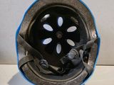 a blue helmet with a flower design on the side of it
