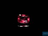a close up of a pink diamond on a black background
