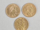 three gold sovereigns, one of which is a sovereign and one of which is a sovereign