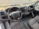 a dashboard of a truck with a steering wheel and dashboard controls