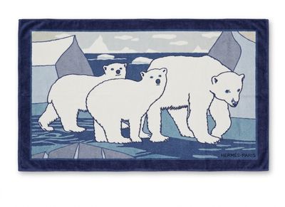 blue and white polar bear rug with three polar bears in the background