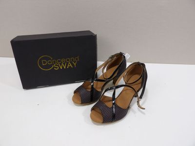 a pair of women ' s shoes in a box on a table