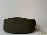 the belt is green and has a white tag on it