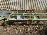 a green metal frame that has been placed on the ground